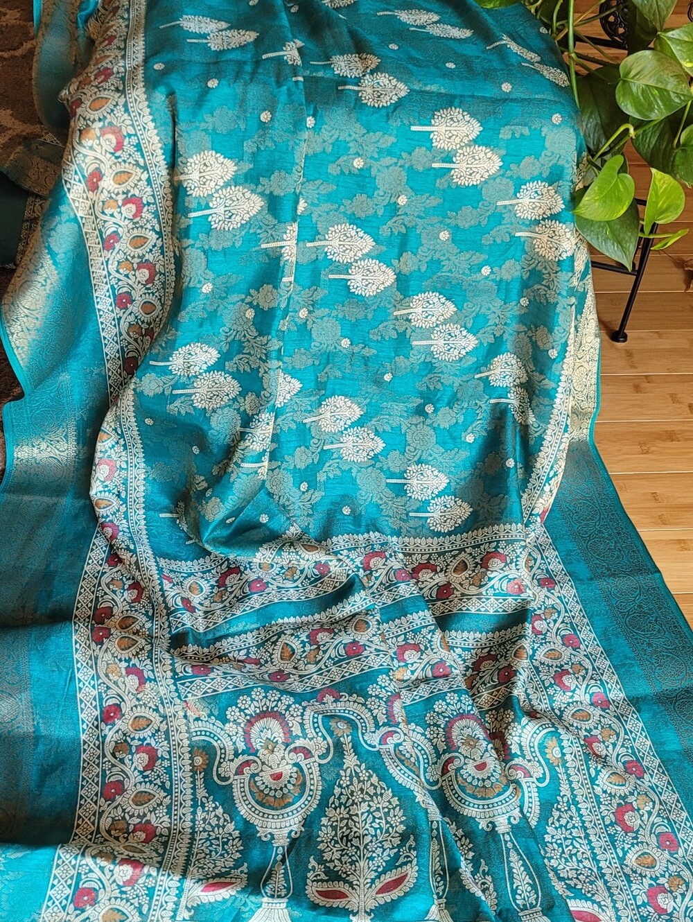 Teal Floral Saree With Combination Of Either Yellow Or Pink Blouse.
